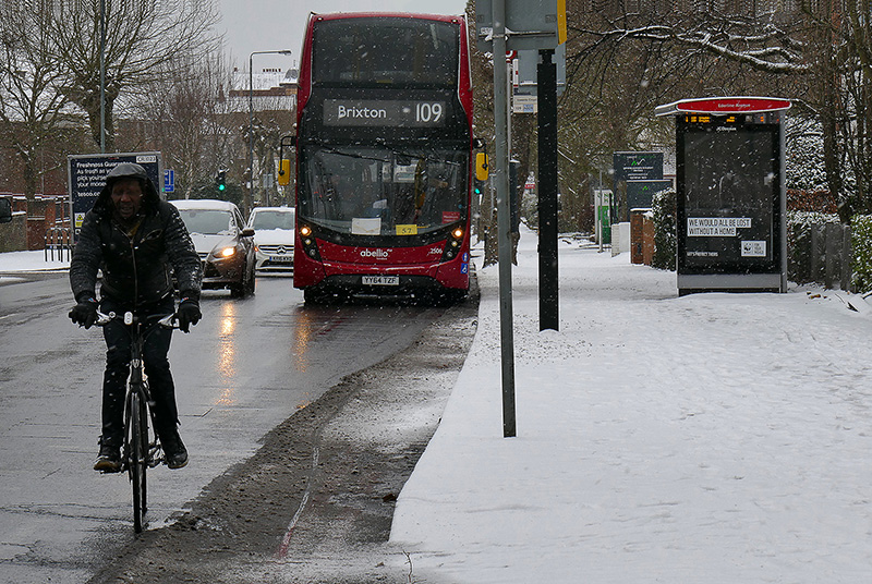 1-Cyclist & RED bus in SNOW P1770947.jpg